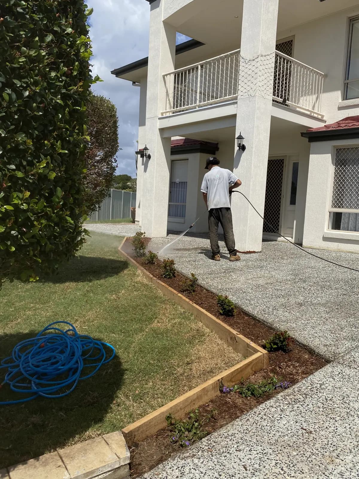 Pressure cleaning around a front garden bed